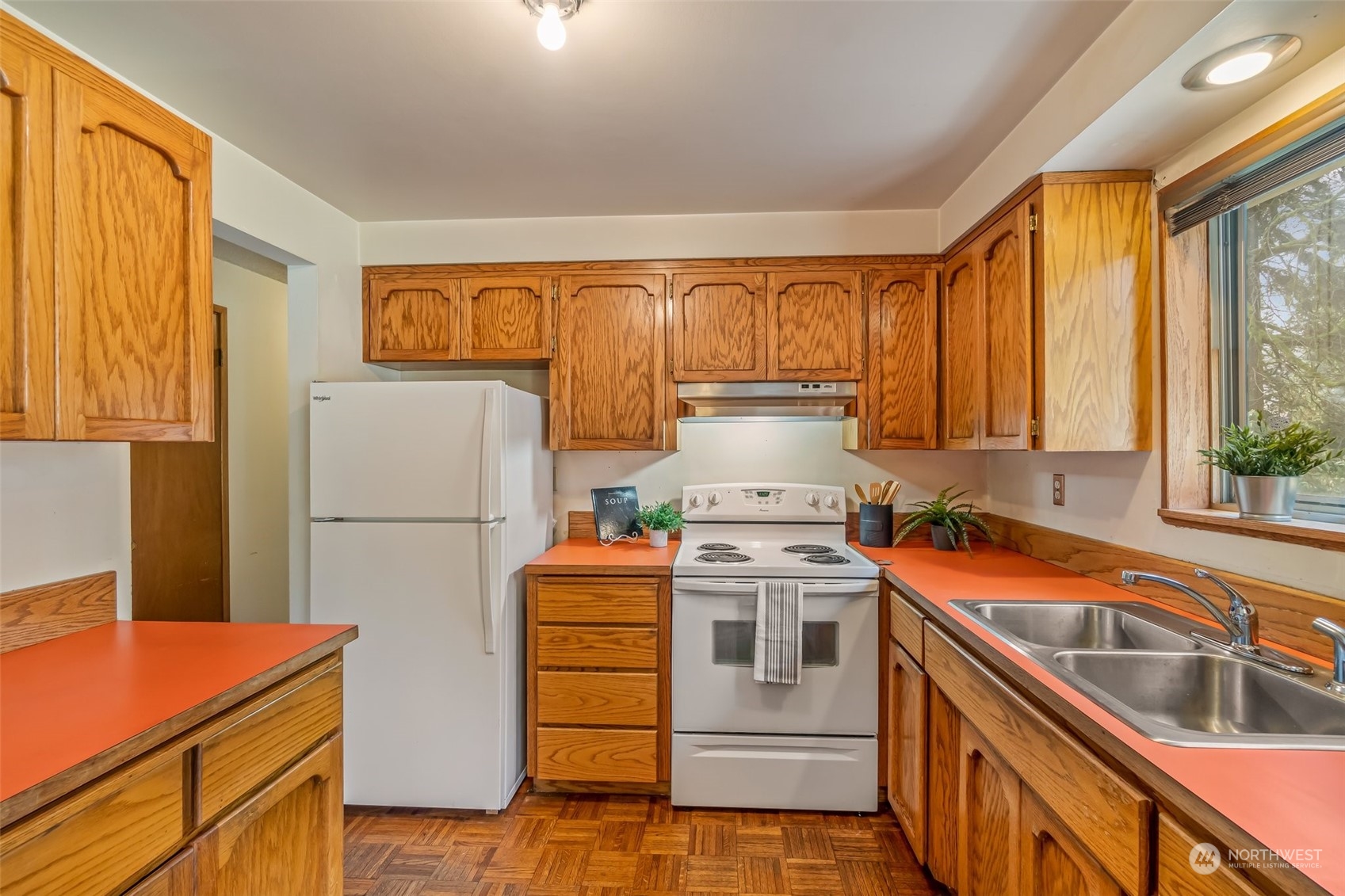 24204 2nd Place West Bothell, WA 98021 - Photo 11 of 34 a kitchen with a refrigerator and a sink