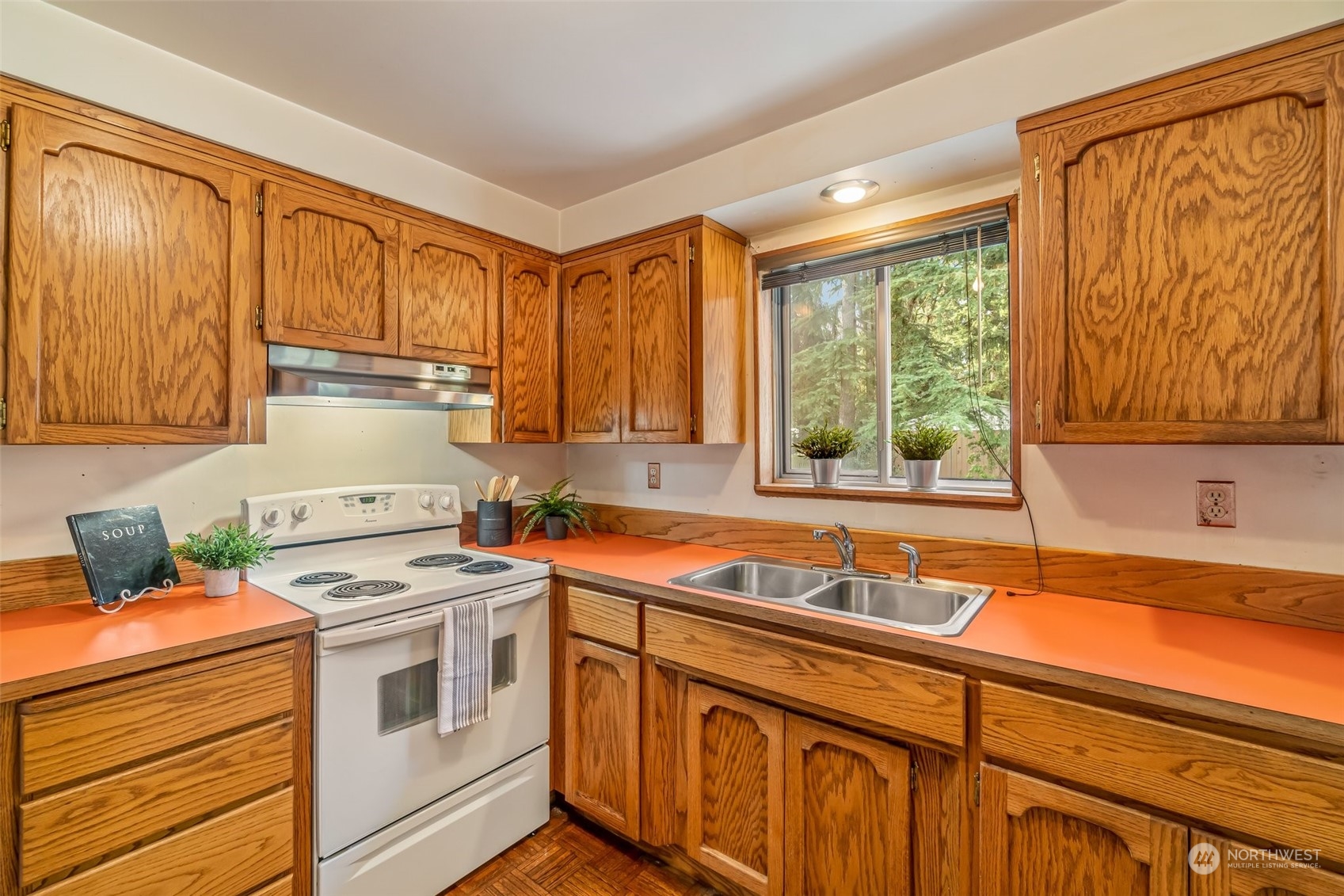 24204 2nd Place West Bothell, WA 98021 - Photo 12 of 34 a kitchen with stainless steel appliances a stove sink and cabinets