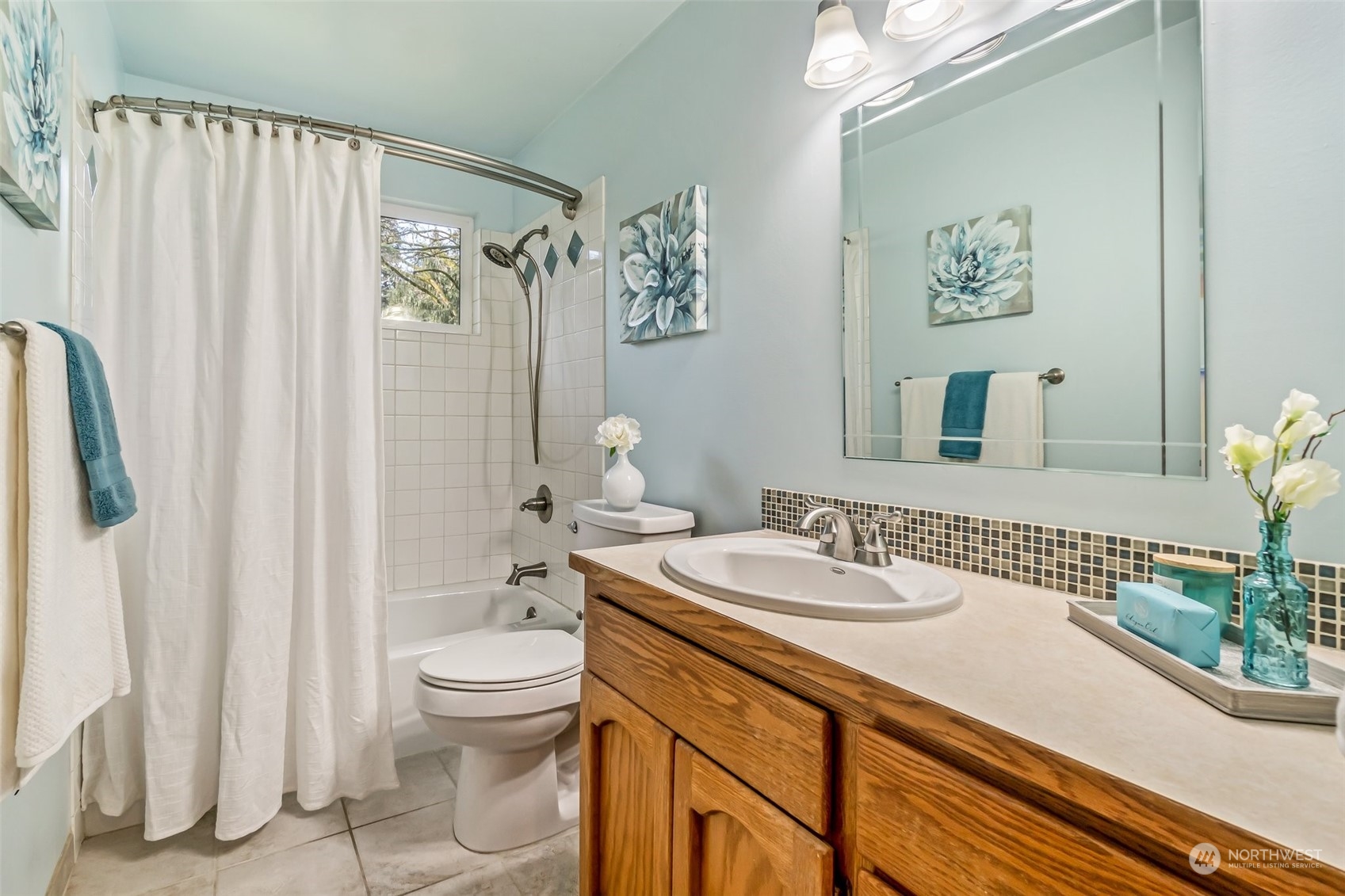 24204 2nd Place West Bothell, WA 98021 - Photo 18 of 34 a bathroom with a sink a toilet and shower curtain