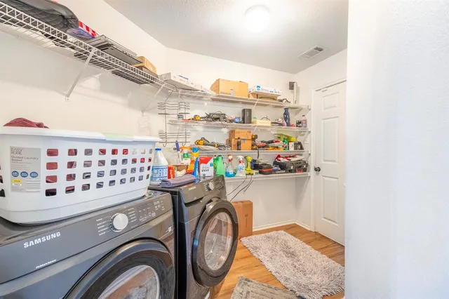 a utility room with dryer and washer