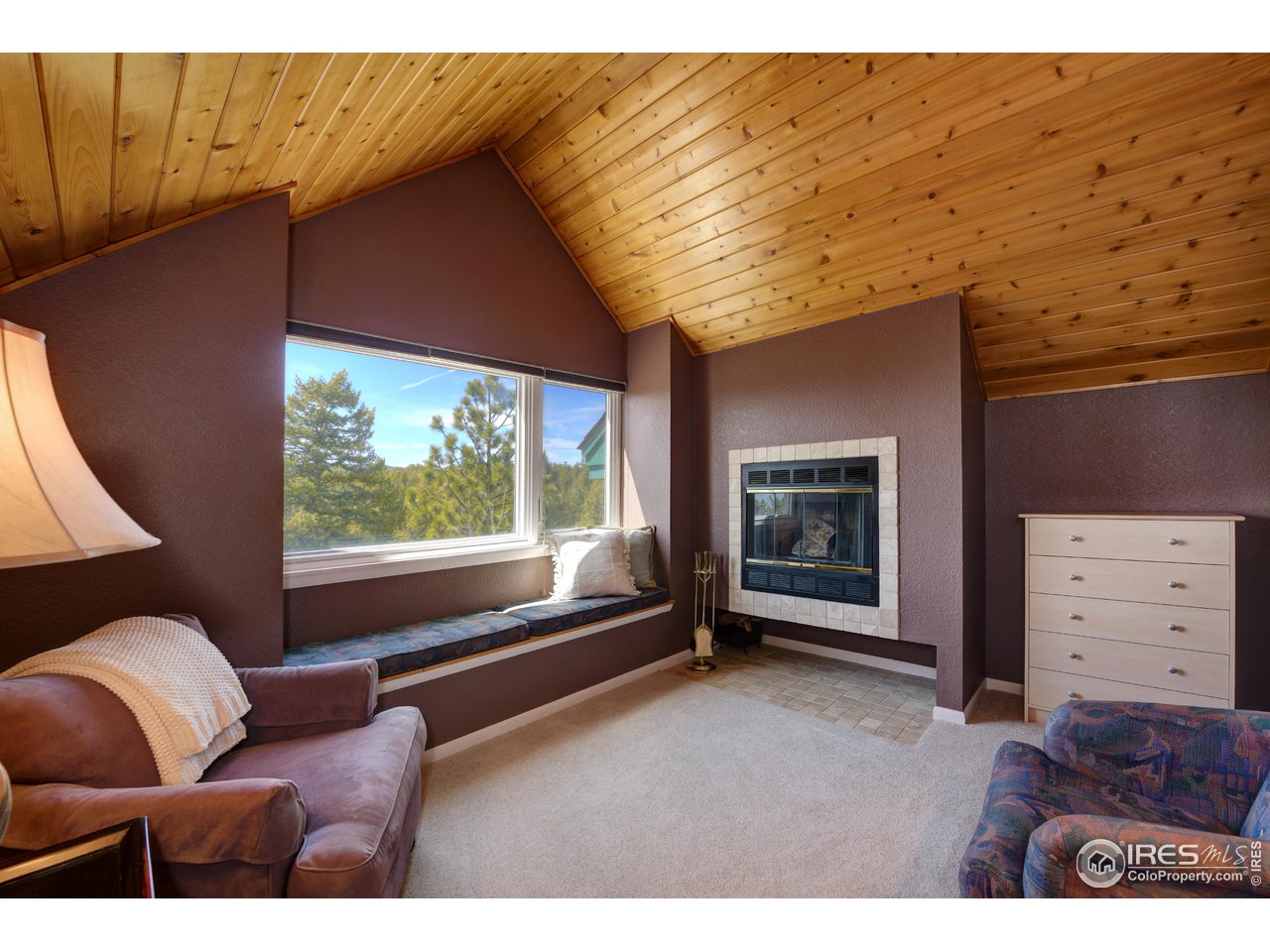 6028 Flagstaff Road Boulder, CO 80302 - Photo 32 of 40 Primary Suite Fireplace and Sitting Area, Bathed in Natural Light
