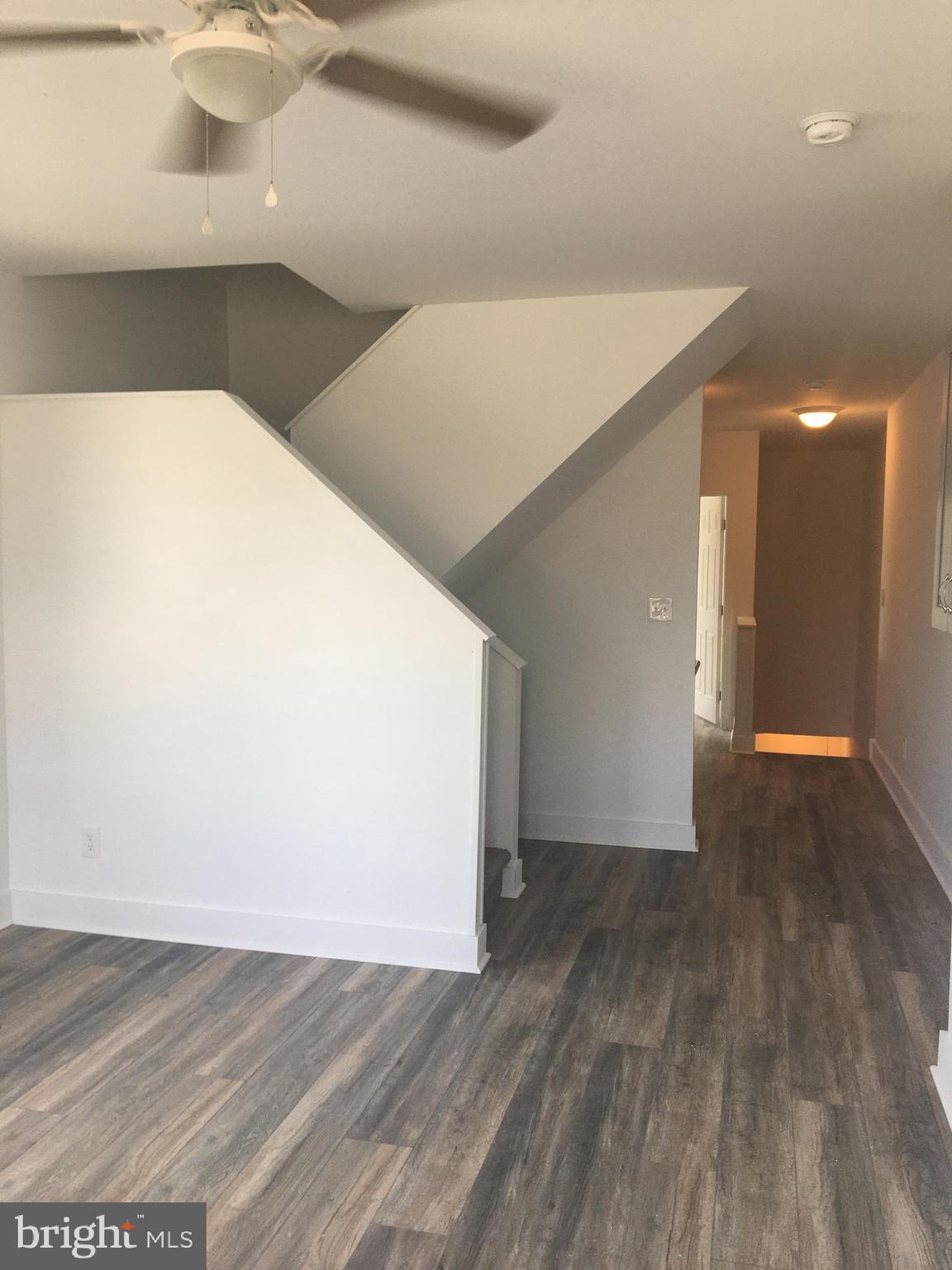 1908 Darby Road, Unit 2 Havertown, PA 19083 - Photo 6 of 14 a view of empty room with wooden floor