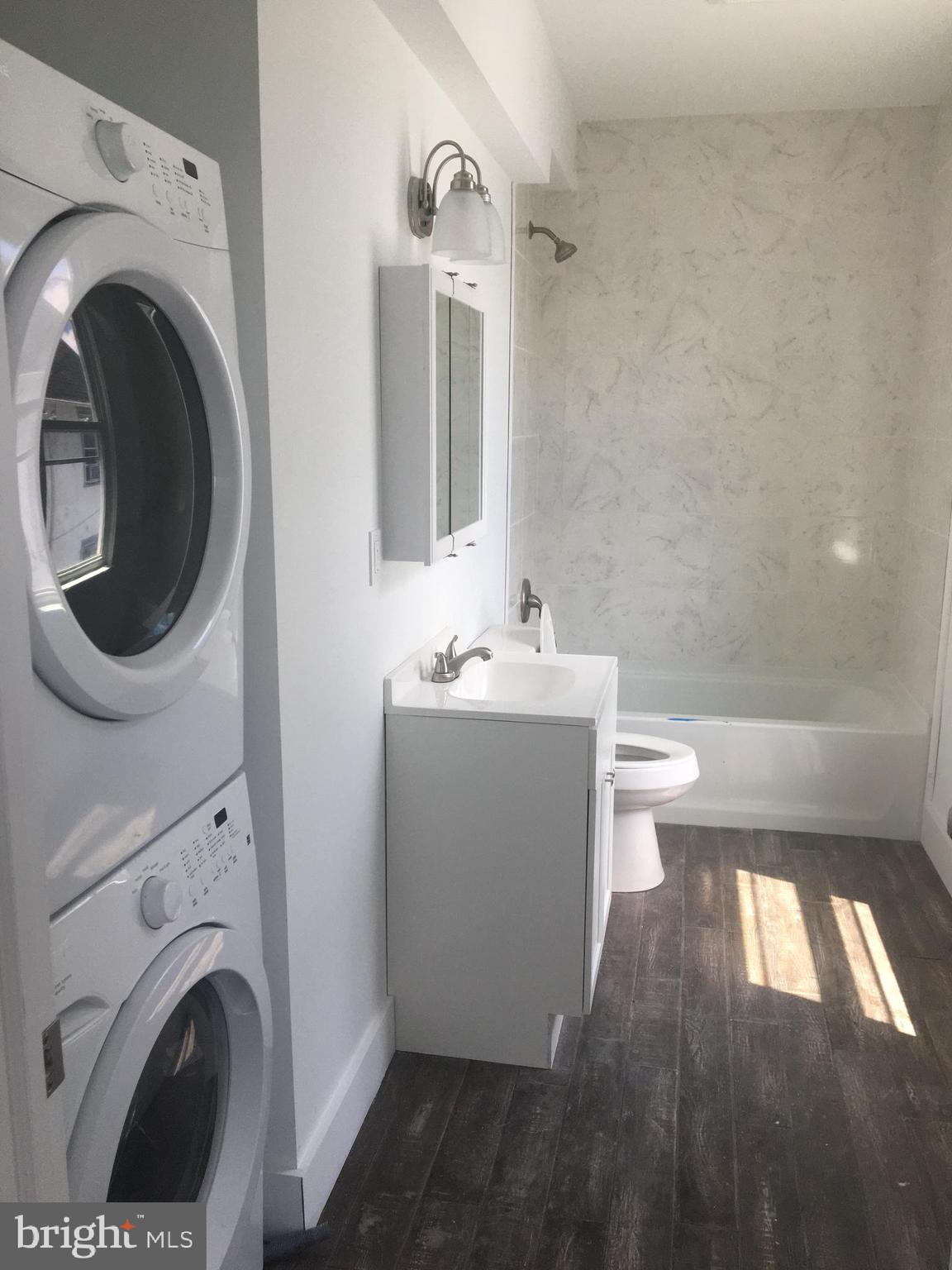1908 Darby Road, Unit 2 Havertown, PA 19083 - Photo 7 of 14 a view of a bathroom with washing machine and sink