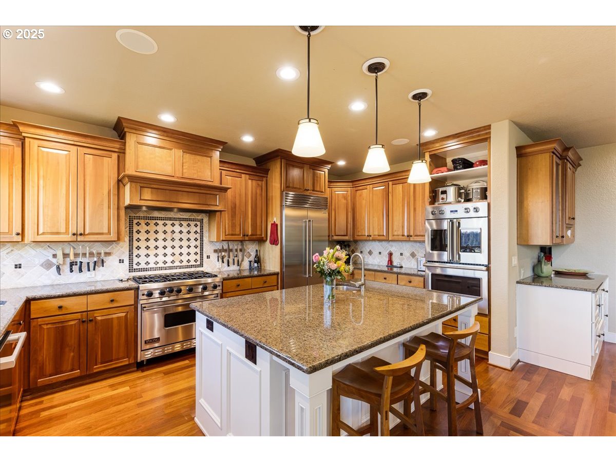 6643 Northwest Meridian Ridge Drive Portland, OR 97210 - Photo 11 of 48 a kitchen with a stove a sink and a refrigerator