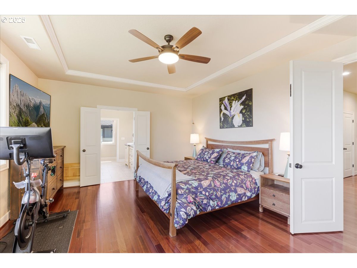 6643 Northwest Meridian Ridge Drive Portland, OR 97210 - Photo 15 of 48 a bedroom with bed and wooden floor