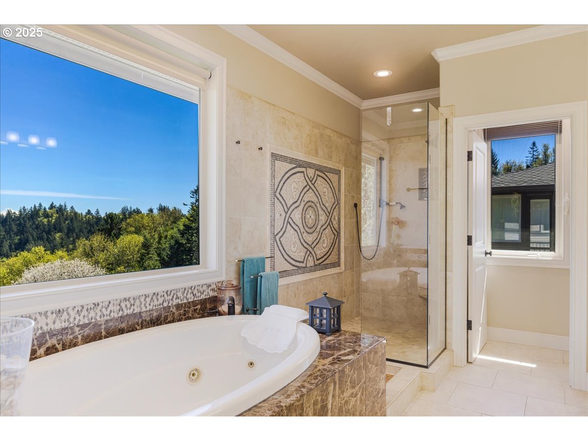 6643 Northwest Meridian Ridge Drive Portland, OR 97210 - Photo 17 of 48 a bathroom with a bathtub and a shower