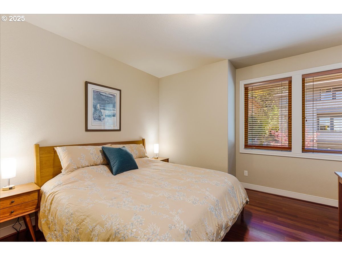 6643 Northwest Meridian Ridge Drive Portland, OR 97210 - Photo 21 of 48 a bedroom with a bed and a window