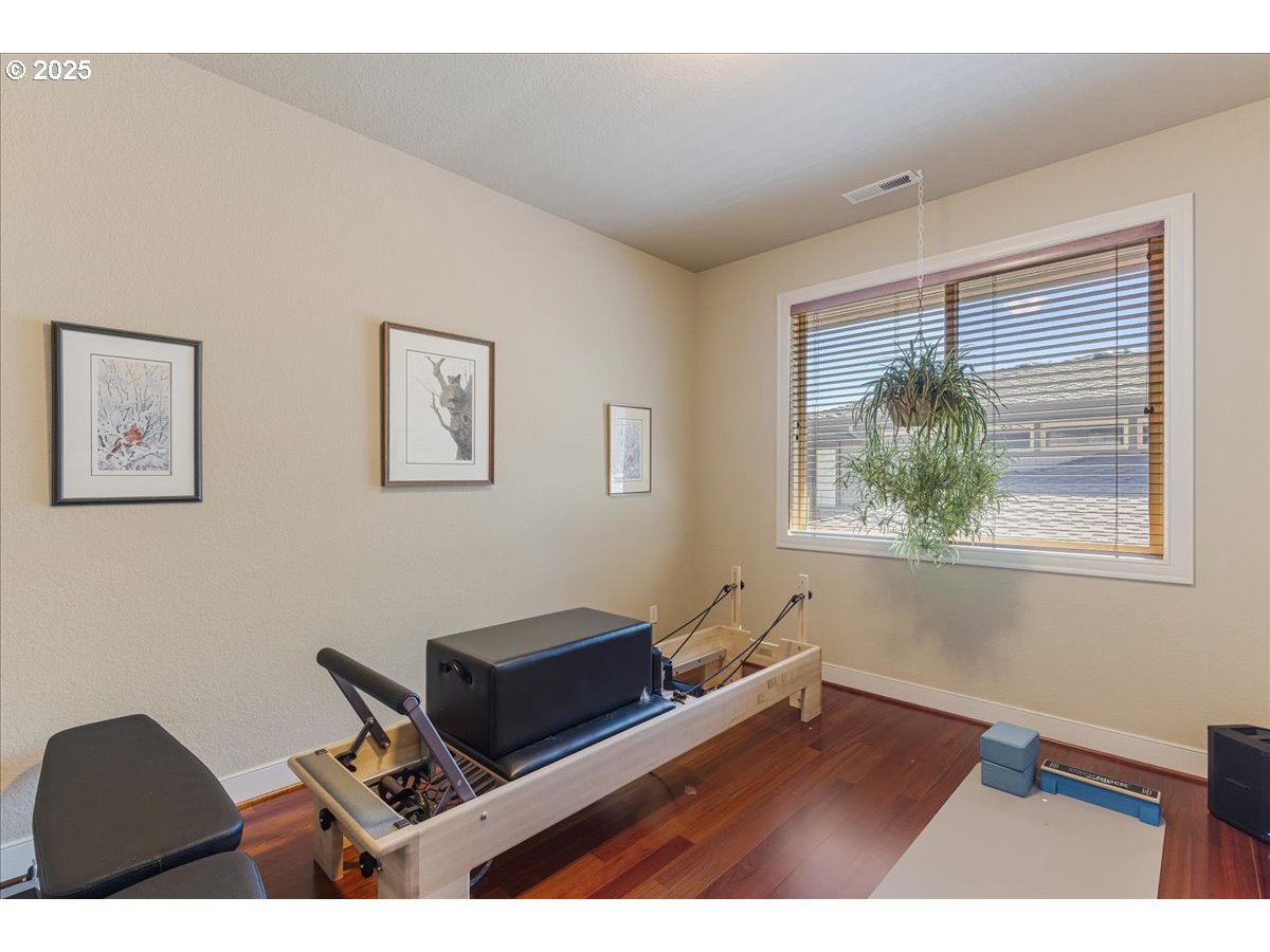 6643 Northwest Meridian Ridge Drive Portland, OR 97210 - Photo 22 of 48 a living room with furniture and a window