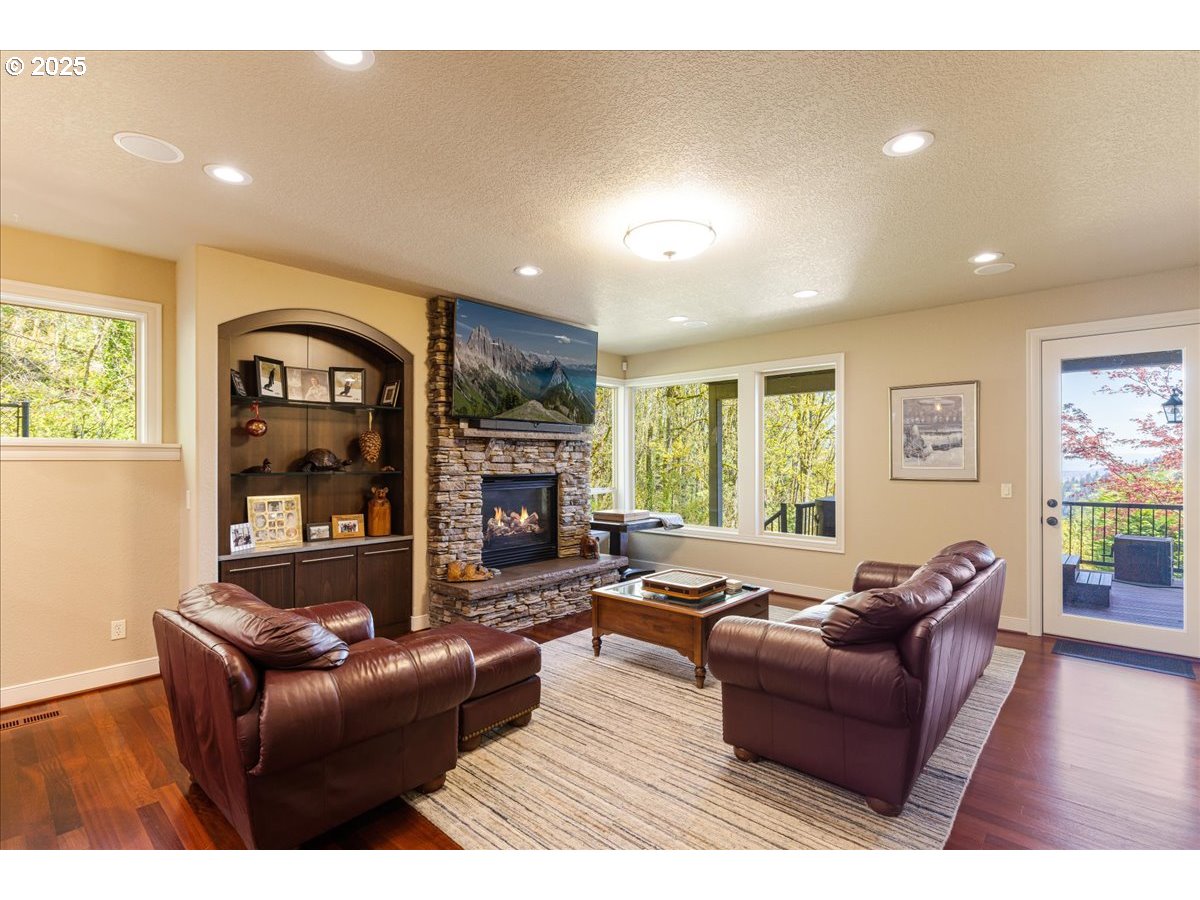 6643 Northwest Meridian Ridge Drive Portland, OR 97210 - Photo 28 of 48 a living room with furniture and a fireplace