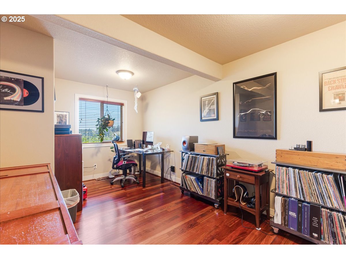 6643 Northwest Meridian Ridge Drive Portland, OR 97210 - Photo 30 of 48 a workspace with furniture window and wooden floor