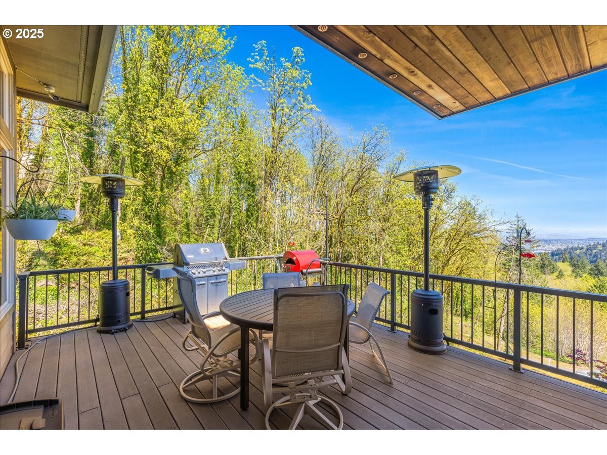 6643 Northwest Meridian Ridge Drive Portland, OR 97210 - Photo 37 of 48 a view of a chairs and table on the wooden deck