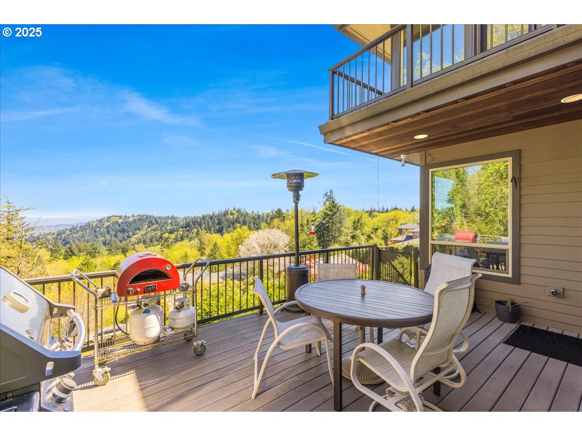 6643 Northwest Meridian Ridge Drive Portland, OR 97210 - Photo 39 of 48 a view of a chairs and table in the balcony