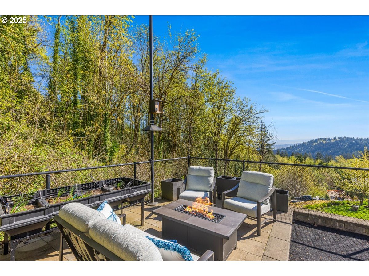 6643 Northwest Meridian Ridge Drive Portland, OR 97210 - Photo 44 of 48 a view of a balcony with chairs