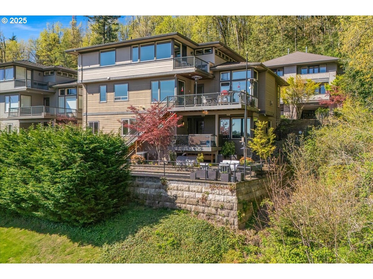 6643 Northwest Meridian Ridge Drive Portland, OR 97210 - Photo 46 of 48 a front view of a house with garden