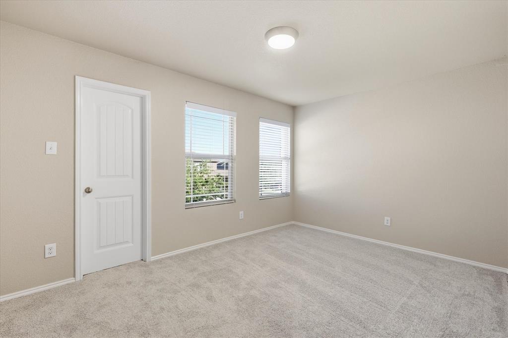 7708 Boat Wind Road Fort Worth, TX 76179 - Photo 16 of 23 Empty Room with light colored carpet