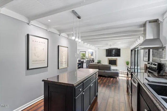 a kitchen that has a sink and a stove