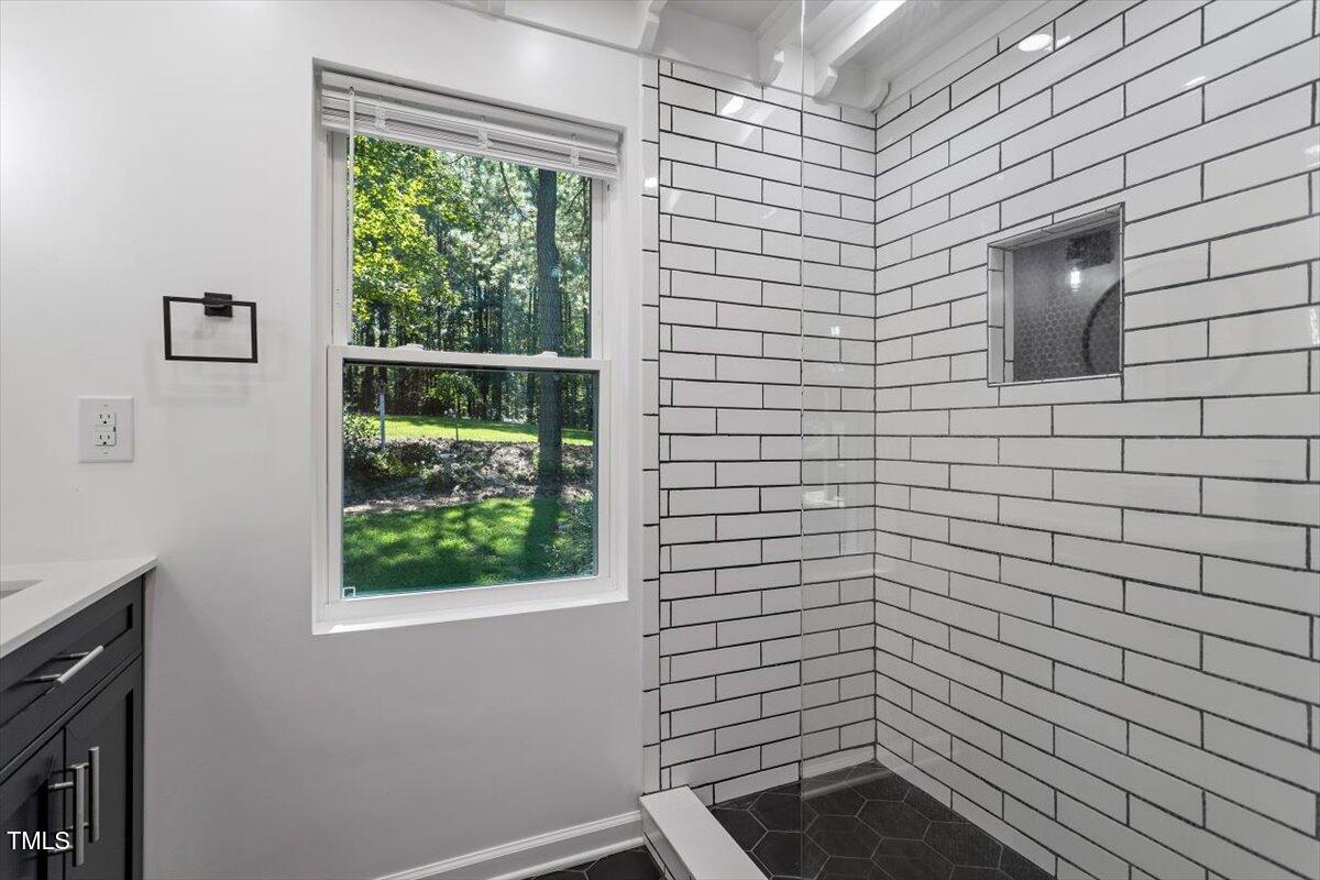 2129 Kelly Road Apex, NC 27502 - Photo 20 of 64 a bathroom with a shower