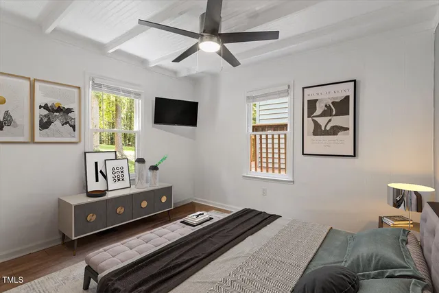 a bedroom with a bed and a table