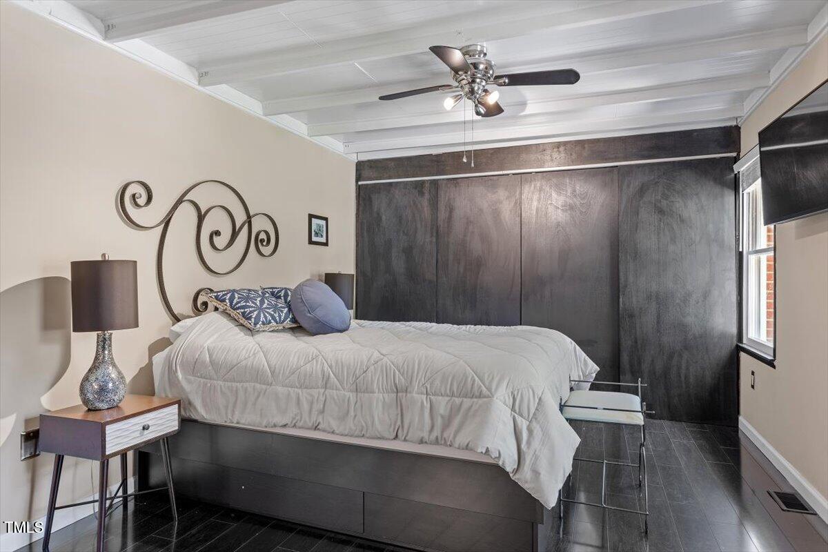 2129 Kelly Road Apex, NC 27502 - Photo 24 of 64 a bedroom with a bed and a table