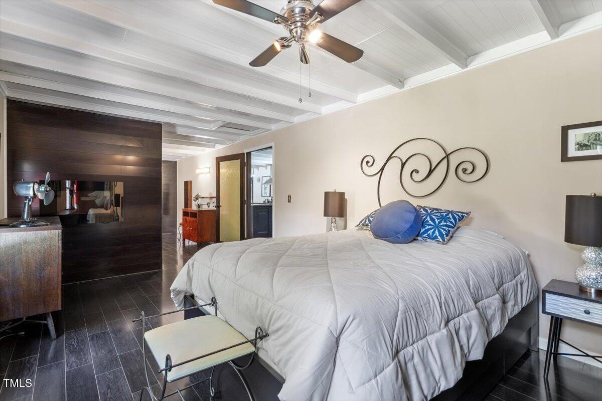 2129 Kelly Road Apex, NC 27502 - Photo 25 of 64 a bedroom with a bed and wooden floor