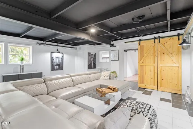 a living room with furniture and a window