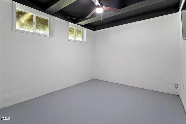 front view of a house with a tree in a yard