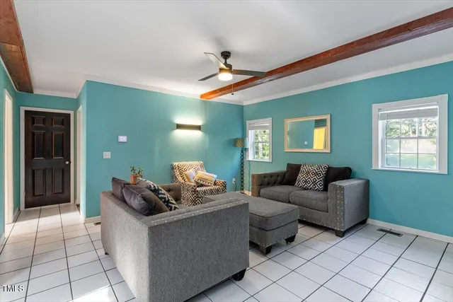 a backyard of a house with table and chairs