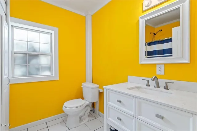 a aerial view of a house with yard and garage