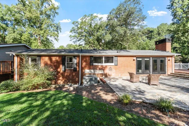 a view of a backyard with wooden fence