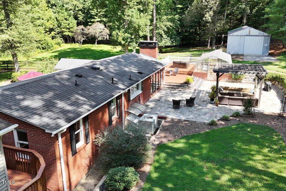 2129 Kelly Road Apex, NC 27502 - Photo 49 of 64 an aerial view of a house with garden space and street view