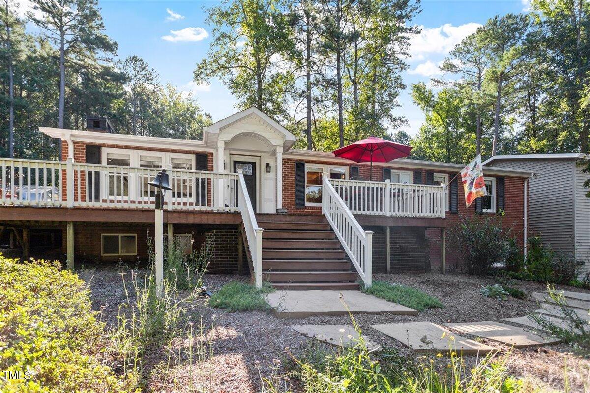 2129 Kelly Road Apex, NC 27502 - Photo 4 of 64 a front view of a house with yard and trees