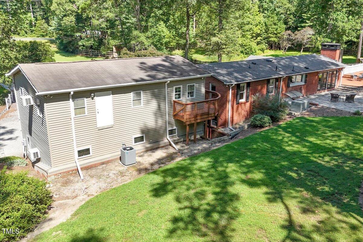 2129 Kelly Road Apex, NC 27502 - Photo 50 of 64 a backyard of a house with table and chairs