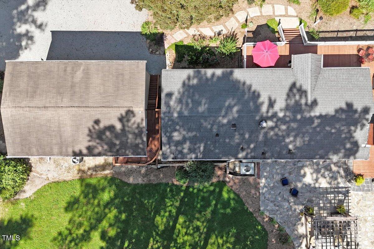 2129 Kelly Road Apex, NC 27502 - Photo 53 of 64 a backyard of a house with a yard and outdoor seating