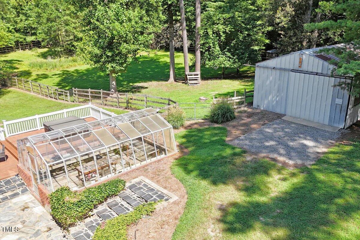 2129 Kelly Road Apex, NC 27502 - Photo 56 of 64 a view of a backyard with wooden fence