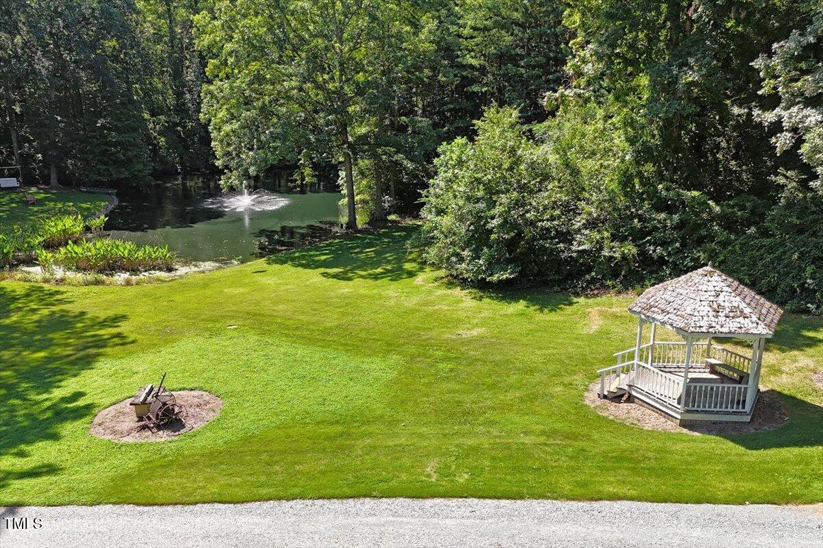 2129 Kelly Road Apex, NC 27502 - Photo 58 of 64 a view of a garden with an outdoor space