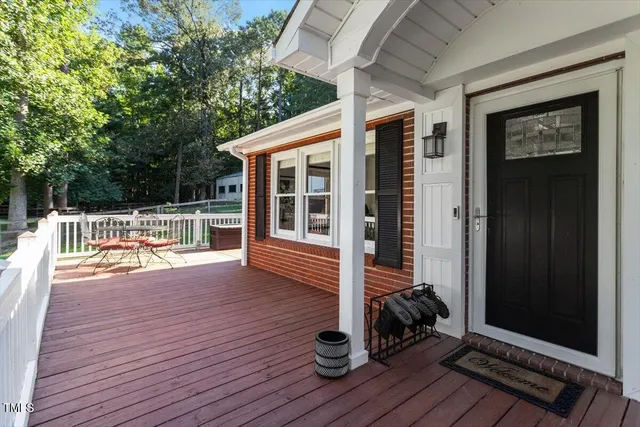 a living room with furniture dining table and a large window