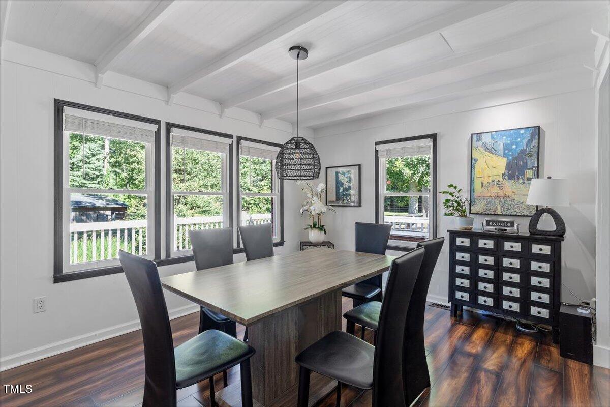 2129 Kelly Road Apex, NC 27502 - Photo 9 of 64 a view of a dining room with furniture window and wooden floor