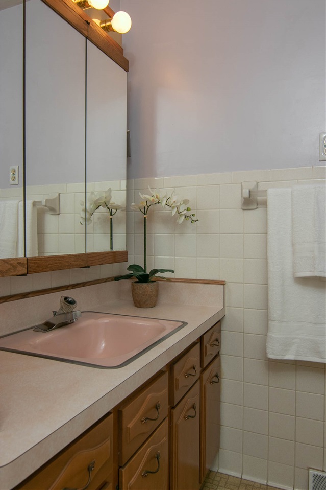 4861 Welsh Road Rockford, IL 61107 - Photo 14 of 21 a bathroom with a sink and a mirror
