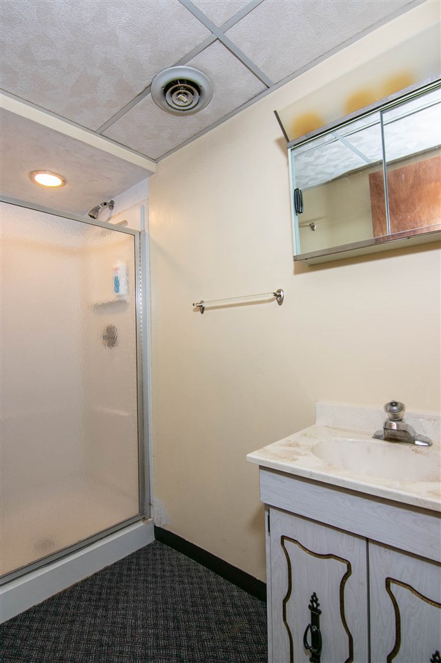 4861 Welsh Road Rockford, IL 61107 - Photo 18 of 21 a bathroom with a sink and a mirror