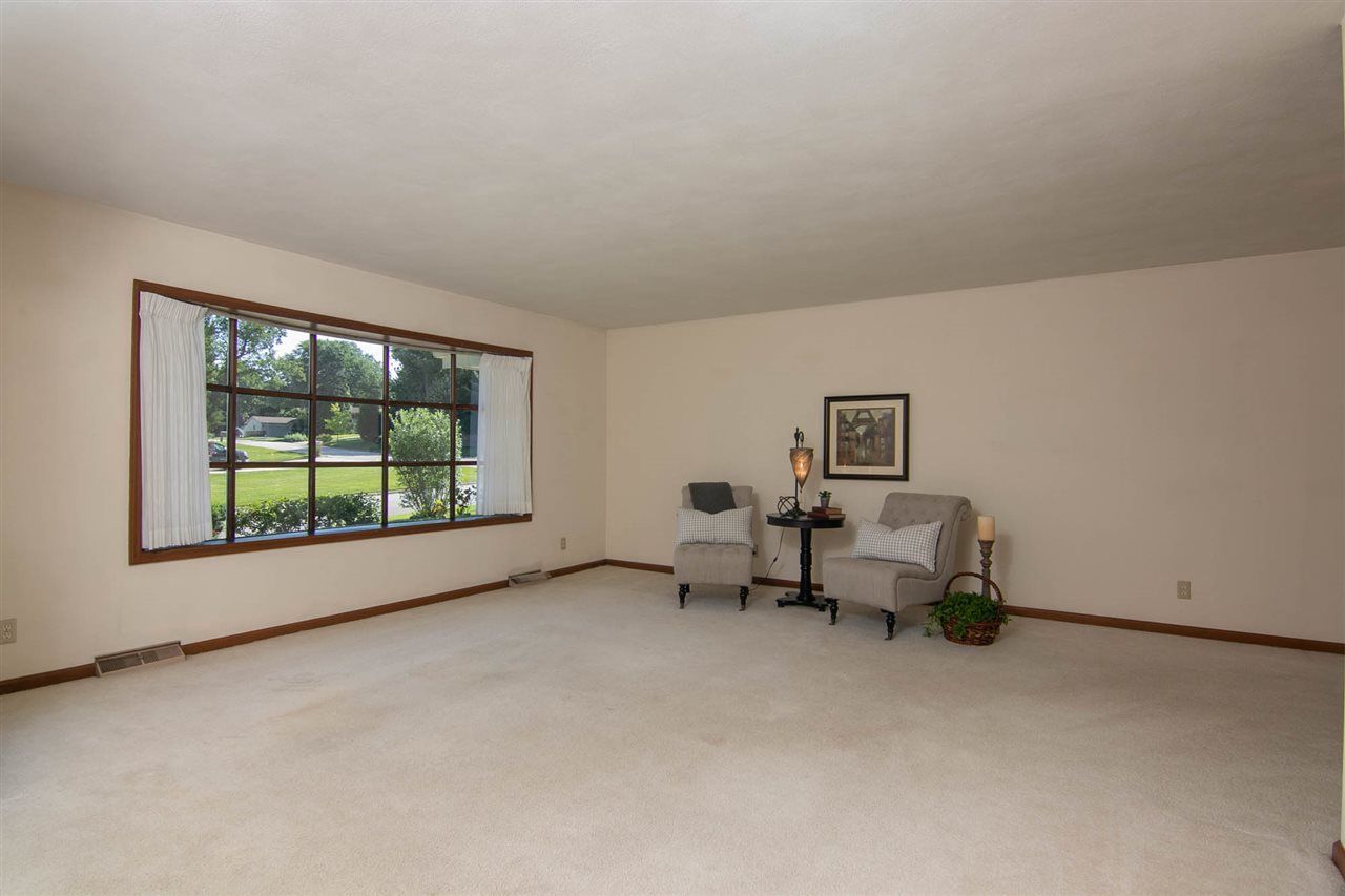 4861 Welsh Road Rockford, IL 61107 - Photo 2 of 21 a living room with furniture and a window