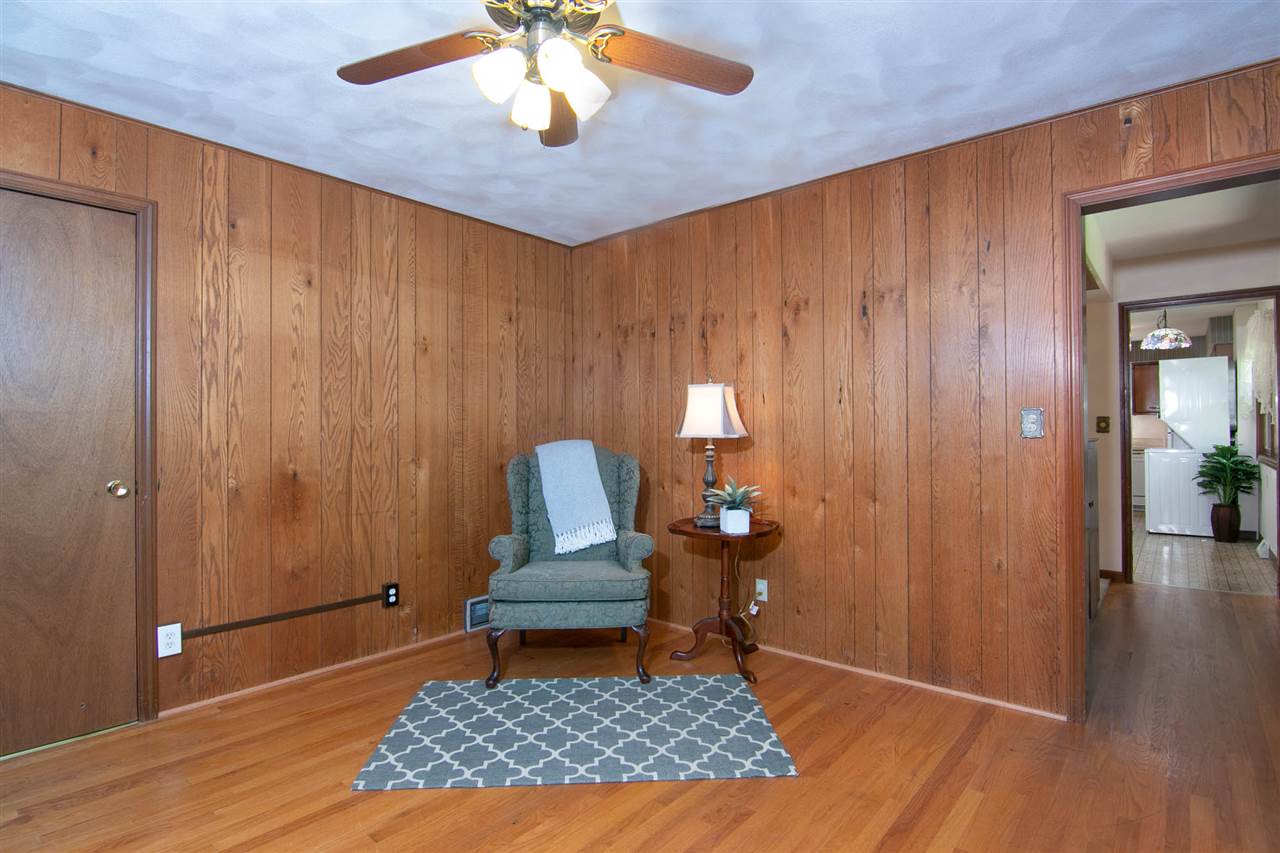 4861 Welsh Road Rockford, IL 61107 - Photo 6 of 21 wooden floor in an empty room with a window