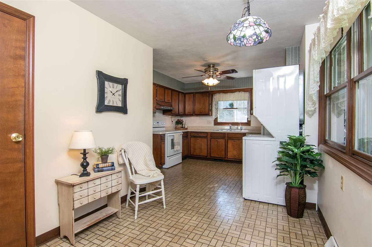 4861 Welsh Road Rockford, IL 61107 - Photo 7 of 21 a kitchen with furniture and chandelier