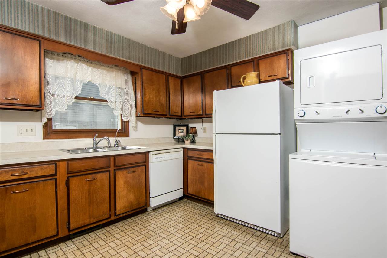 4861 Welsh Road Rockford, IL 61107 - Photo 9 of 21 a kitchen with stainless steel appliances granite countertop a refrigerator and a sink