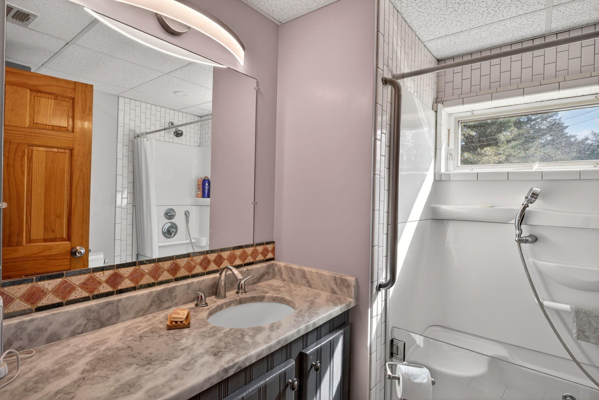 73 County Road Bourne, MA 02532 - Photo 75 of 91 a bathroom with a granite countertop sink and a mirror