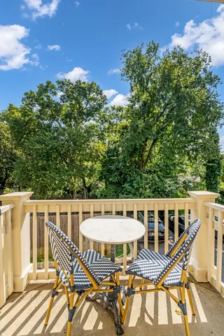 swimming pool view with a seating space