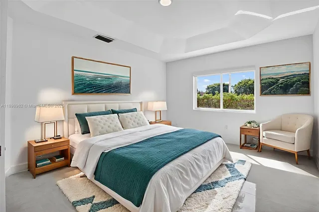 a bedroom with a bed and a couch