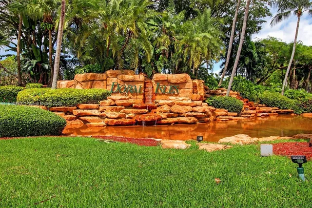 an aerial view of a house with yard swimming pool and outdoor seating
