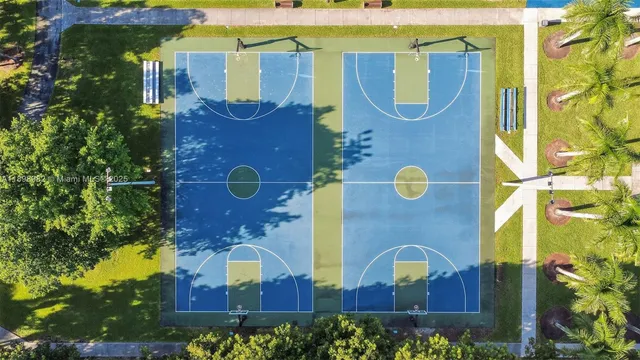a view of a lake with a house and a big yard