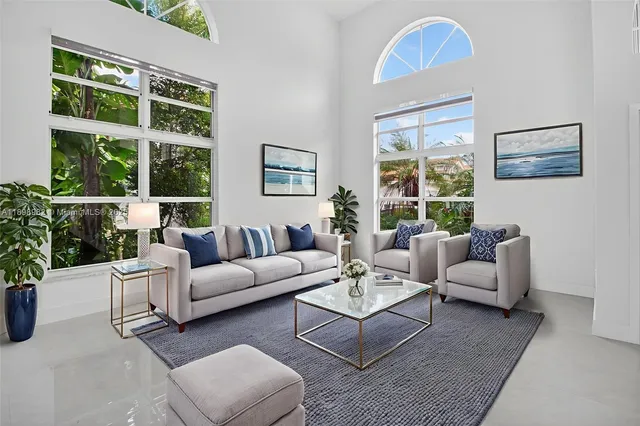 a living room with furniture and windows