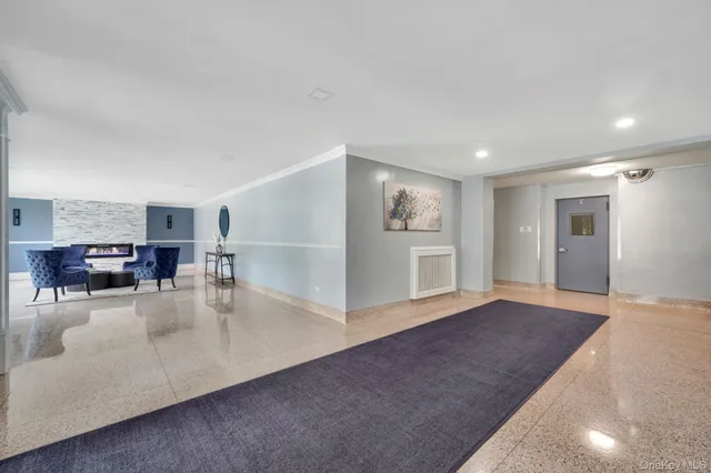a view of a livingroom with furniture and a workspace